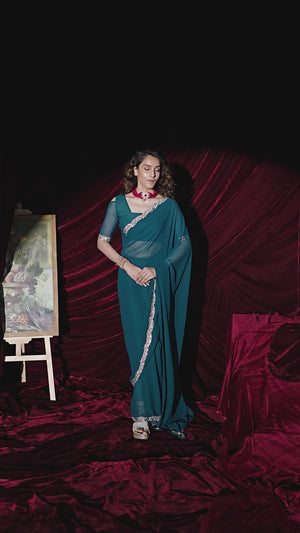 Glamorous Teal Solid Georgette Saree Featuring Embellished Stone Border Work