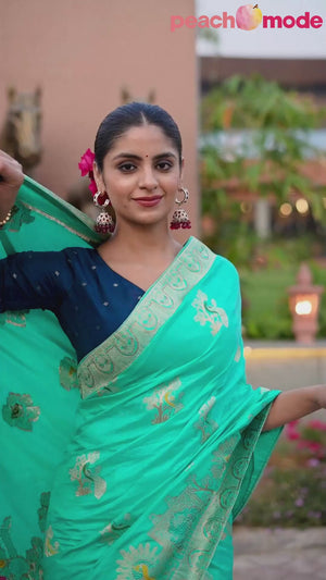 Radiant Turquoise Dola Silk Saree With Intricate Zari Weaving & Swarovski Accents