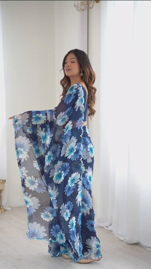 Blue Georgette Saree Featuring Floral Prints & Shimmering Mirror Work Border