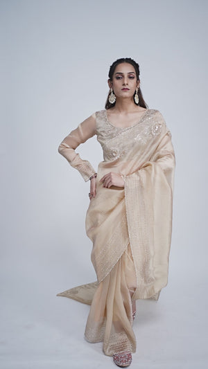 Elegant Cream Kanjivaram Silk Saree Adorned With Stone Work & Cut Dana Detailing
