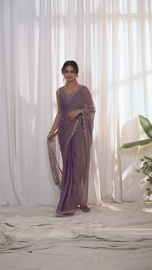 Designer Lavender Georgette Saree Adorned With An Elegant Zarkan Cutwork Border