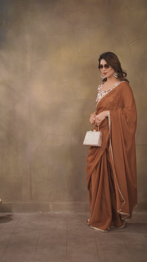 Brown Solid Sparkling Georgette Saree Enhanced With Shimmering Mirror Border