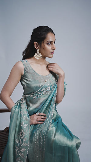 Elegant Turquoise Kanjivaram Silk Saree Adorned With Stone Work & Cut Dana Detailing