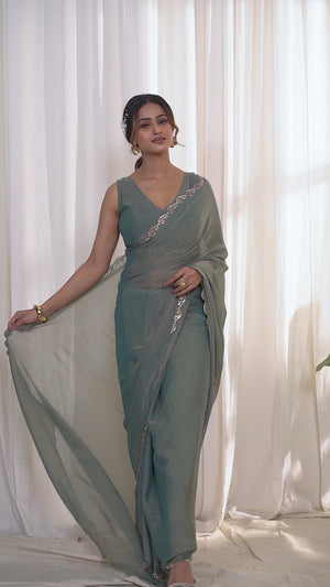 Designer Sage Green Georgette Saree Adorned With An Elegant Zarkan Cutwork Border