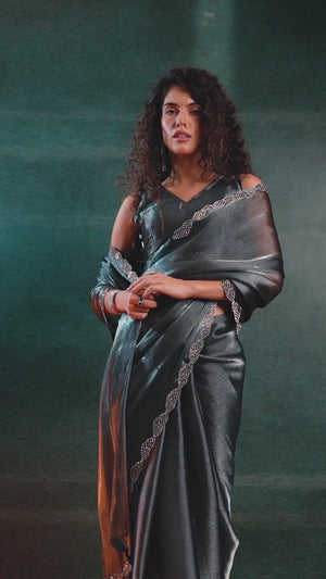 Grey Solid Tissue Chiffon Saree Accentuated With A Sparkling Zarkan Work Border