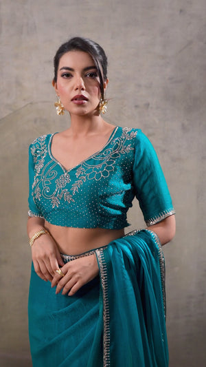 Teal Solid Chiffon Saree With Sparkling Zarkan Border & Latkan Pallu