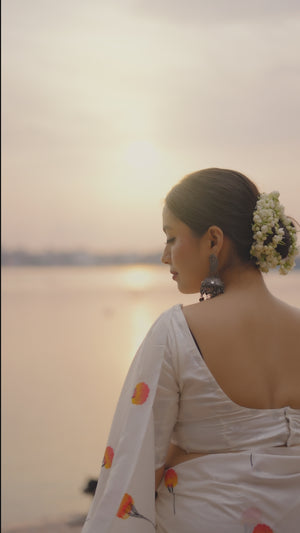 Elegant White Banarasi Silk Saree With Floral Zari Weaving & Tassel Border