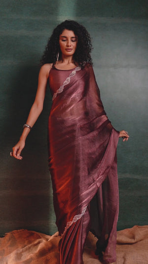 Burgundy Solid Tissue Chiffon Saree Accentuated With A Sparkling Zarkan Work Border