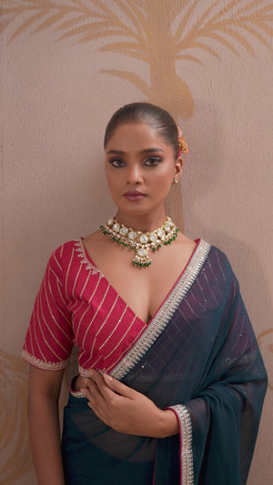 Teal Zari Embroidered Georgette Saree Accented With Sequins