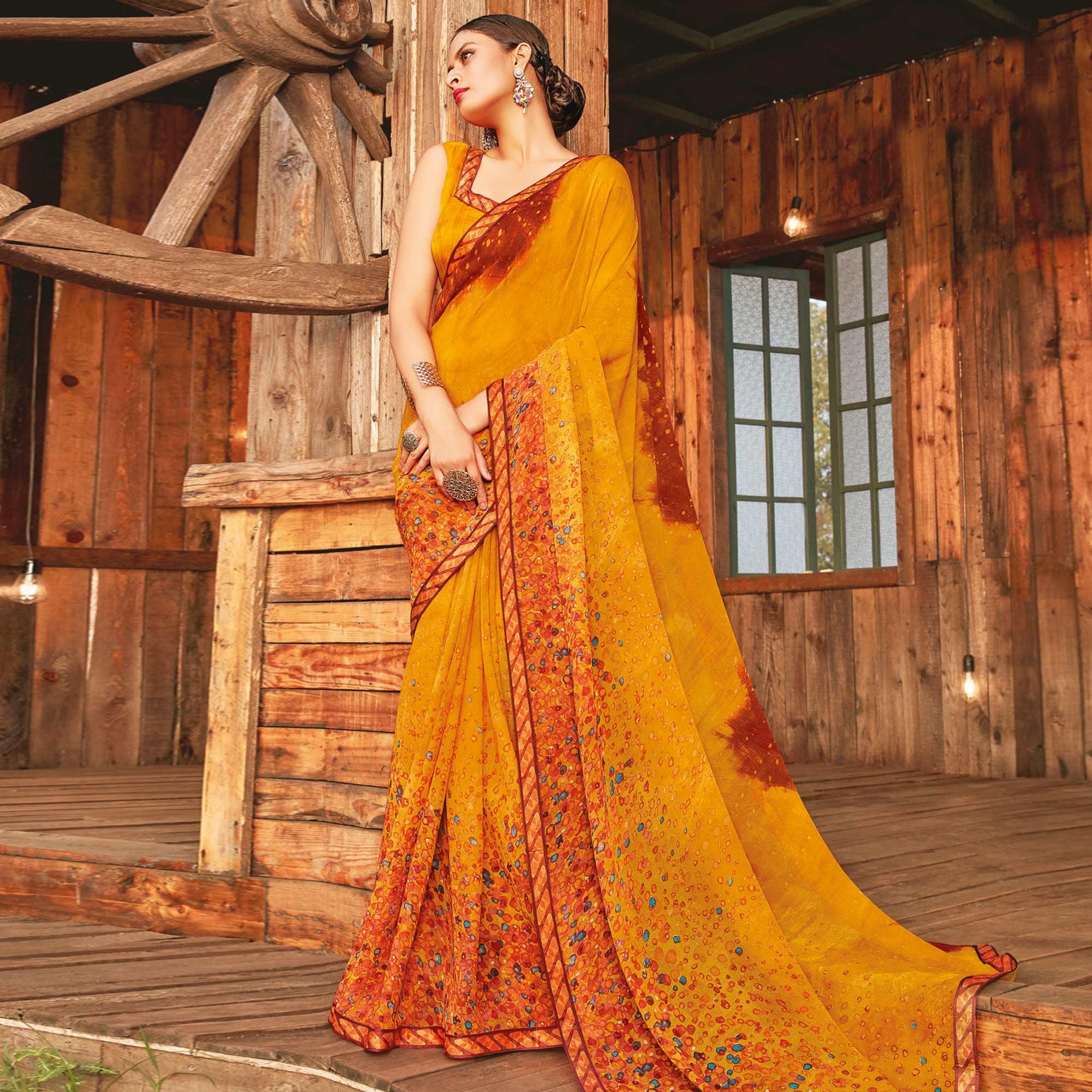 Adorable Mustard Coloured Partywear Pure Georgette Floral Printed Saree With Fancy Lace Border - Peachmode