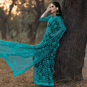 Adorable Turquoise Colored Casual Wear Printed Brasso Saree - Peachmode