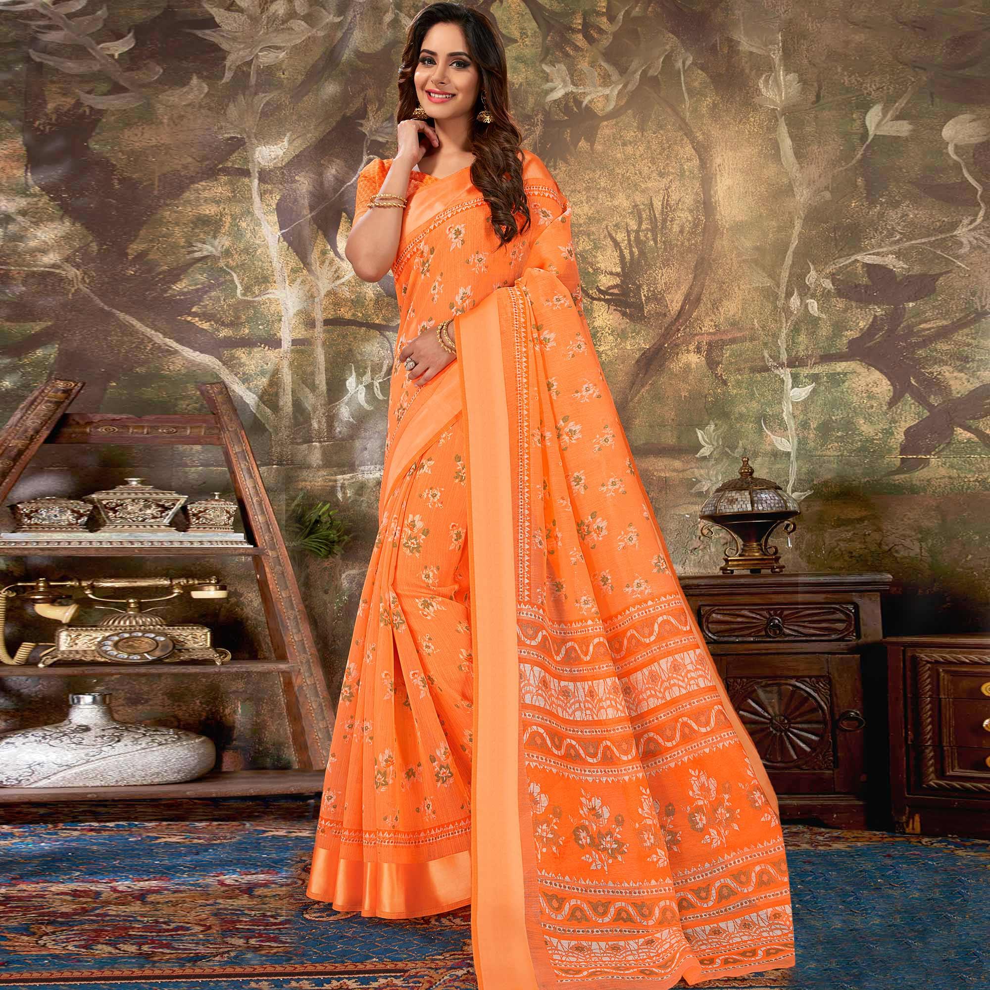 Adorning Orange Colored Casual Wear Floral Printed Cotton Saree - Peachmode