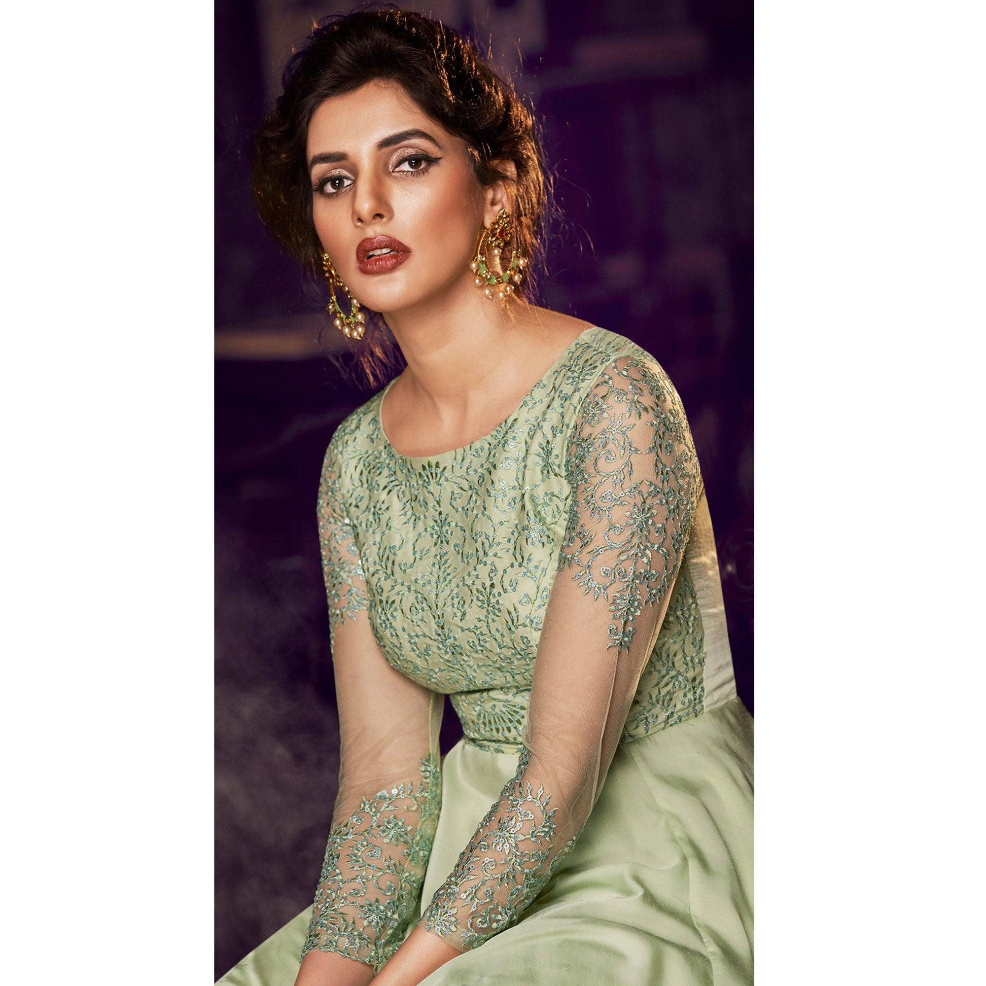 Adorning Pista Green Colored Partywear Embroidered Modal Satin Gown With Dupatta - Peachmode
