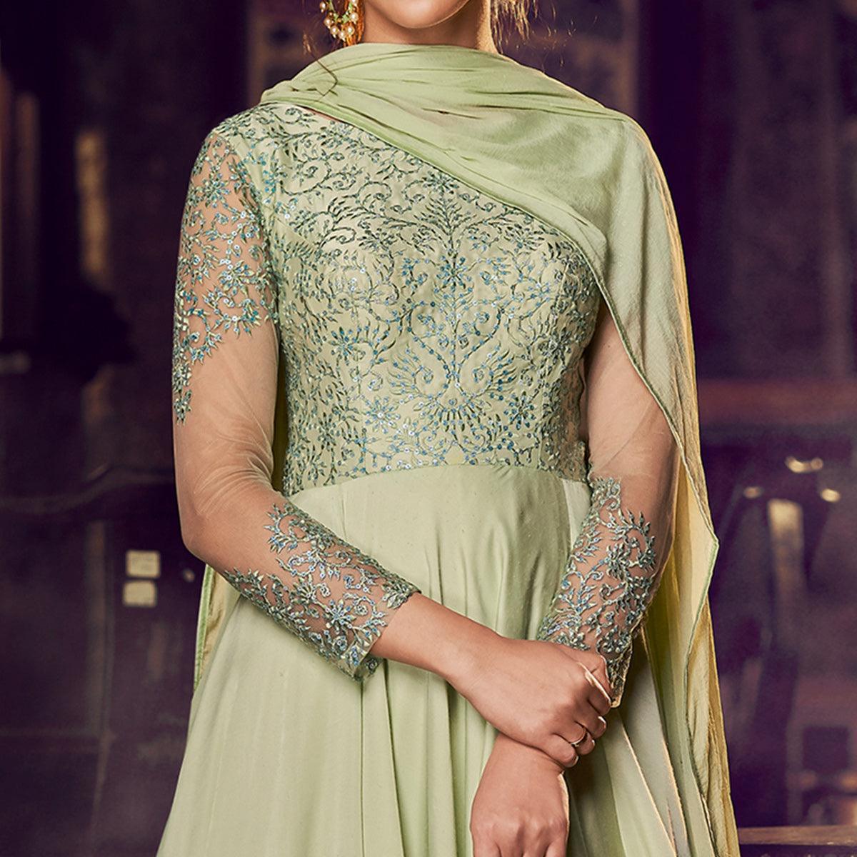 Adorning Pista Green Colored Partywear Embroidered Modal Satin Gown With Dupatta - Peachmode