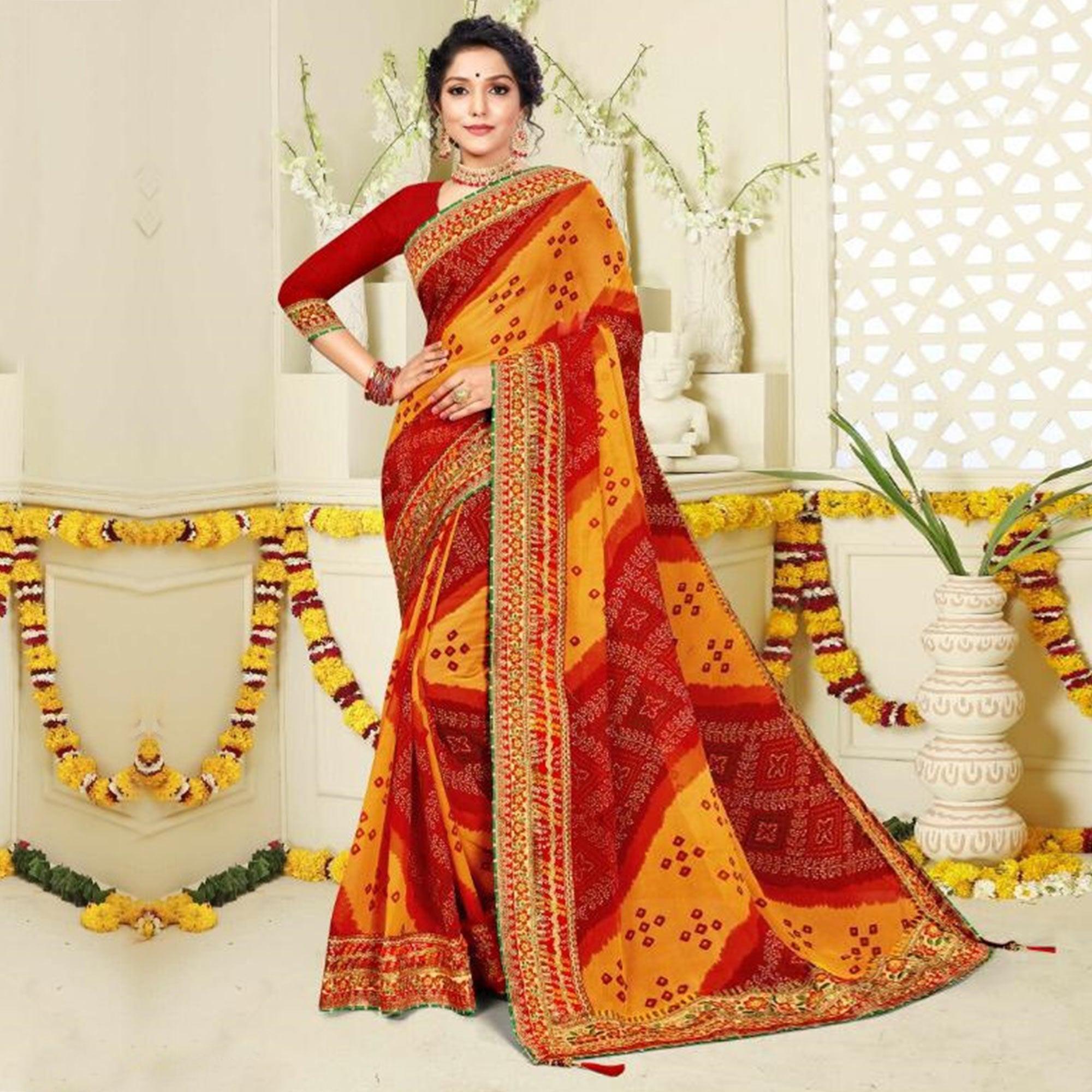 Amazing Red and Yellow Colored Festive Wear Bandhani Print With Zari Border Work And Latkan Heavy Georgette Saree - Peachmode