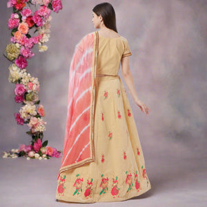 Appealing Cream Colored Partywear Embroidered Velvet Lehenga Choli - Peachmode