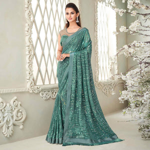 Aqua Blue Sequence Embroidered Georgette Saree With Tassels - Peachmode