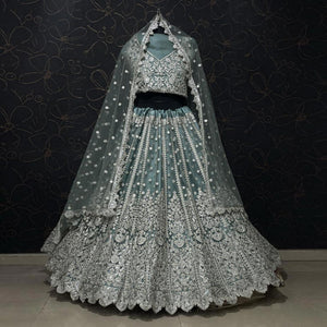 Aqua Green Party Wear Heavy Embroidered Netted Lehenga Choli - Peachmode
