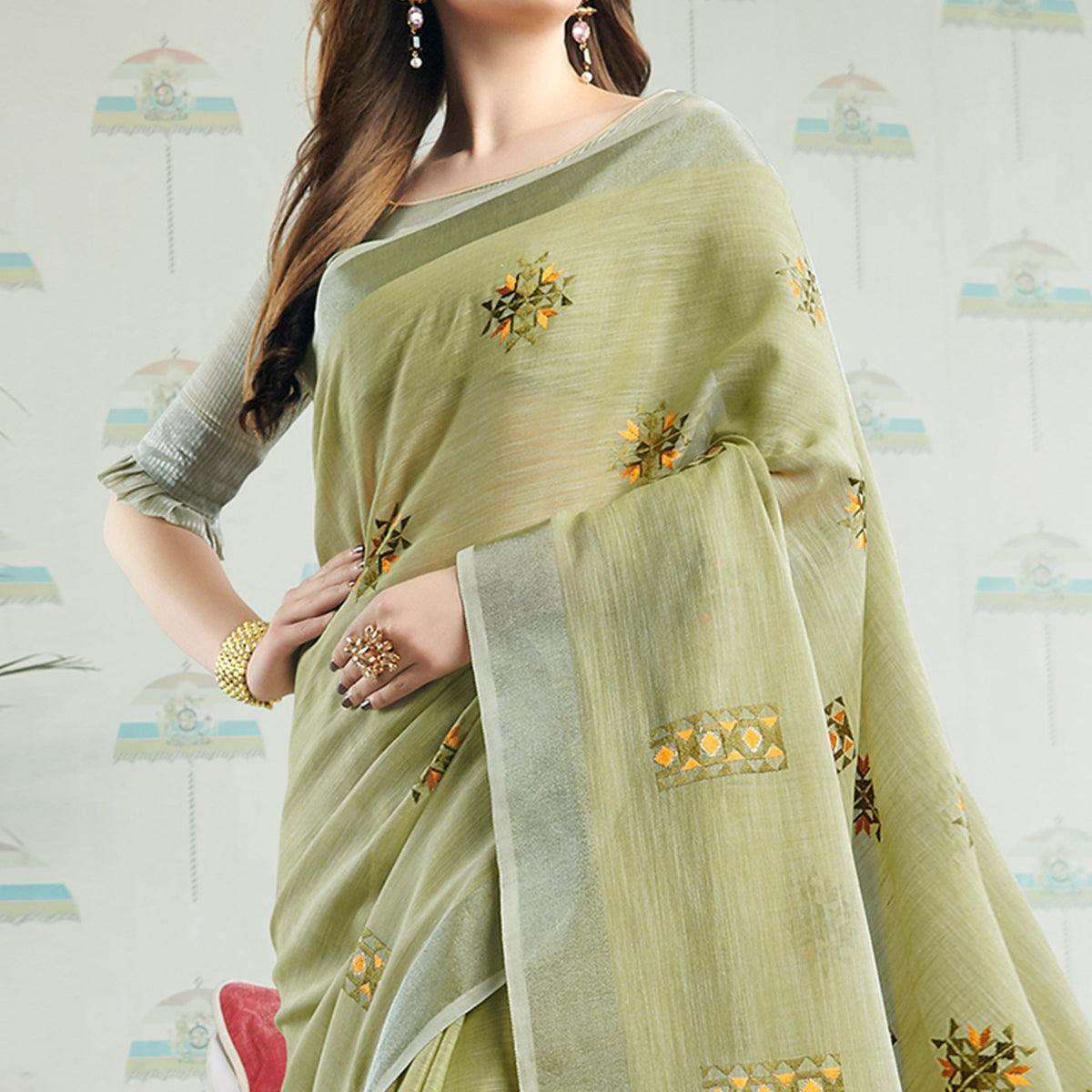 Arresting Pastel Green Colored Casual Wear Floral Embroidered Linen-Cotton Saree With Tassels - Peachmode