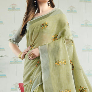 Arresting Pastel Green Colored Casual Wear Floral Embroidered Linen-Cotton Saree With Tassels - Peachmode