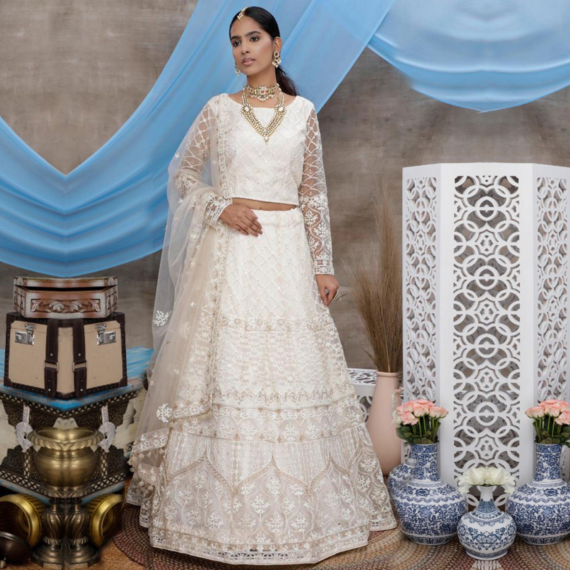 Arresting White Colored Party Wear Embroidered Net Lehenga Choli - Peachmode
