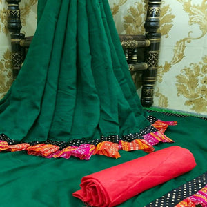 Attractive Bottle Green Colored Partywear Solid Vichitra Silk Saree With Bandhani Print Ruffle - Peachmode