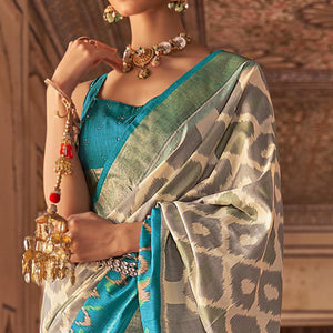 Beige & Light Blue Ikkat Printed-Woven Patola Art Silk Saree - Peachmode
