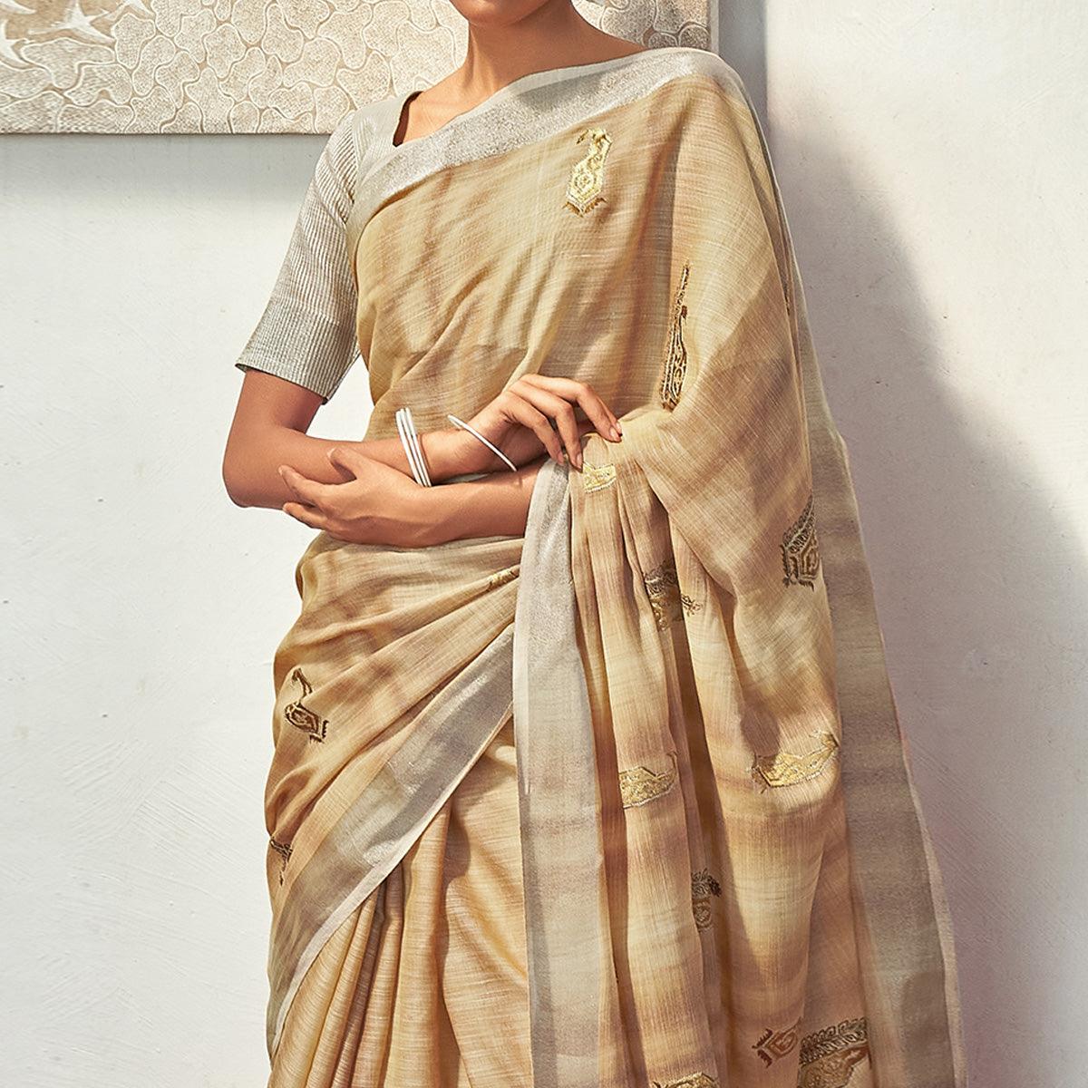 Beige Casual Wear Embroidered Linen Saree With Tassels - Peachmode