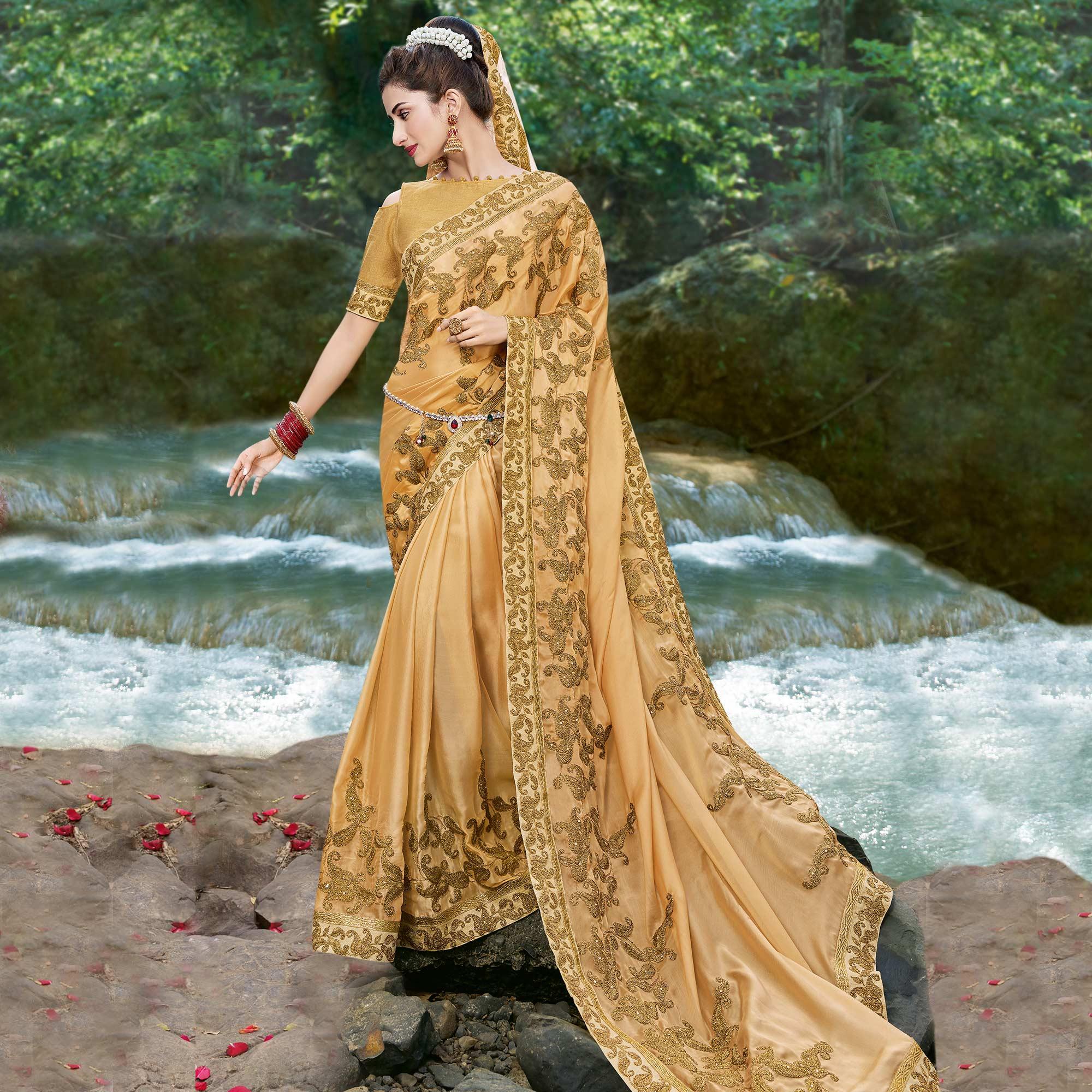 Beige Embroidered Georgette Saree - Peachmode