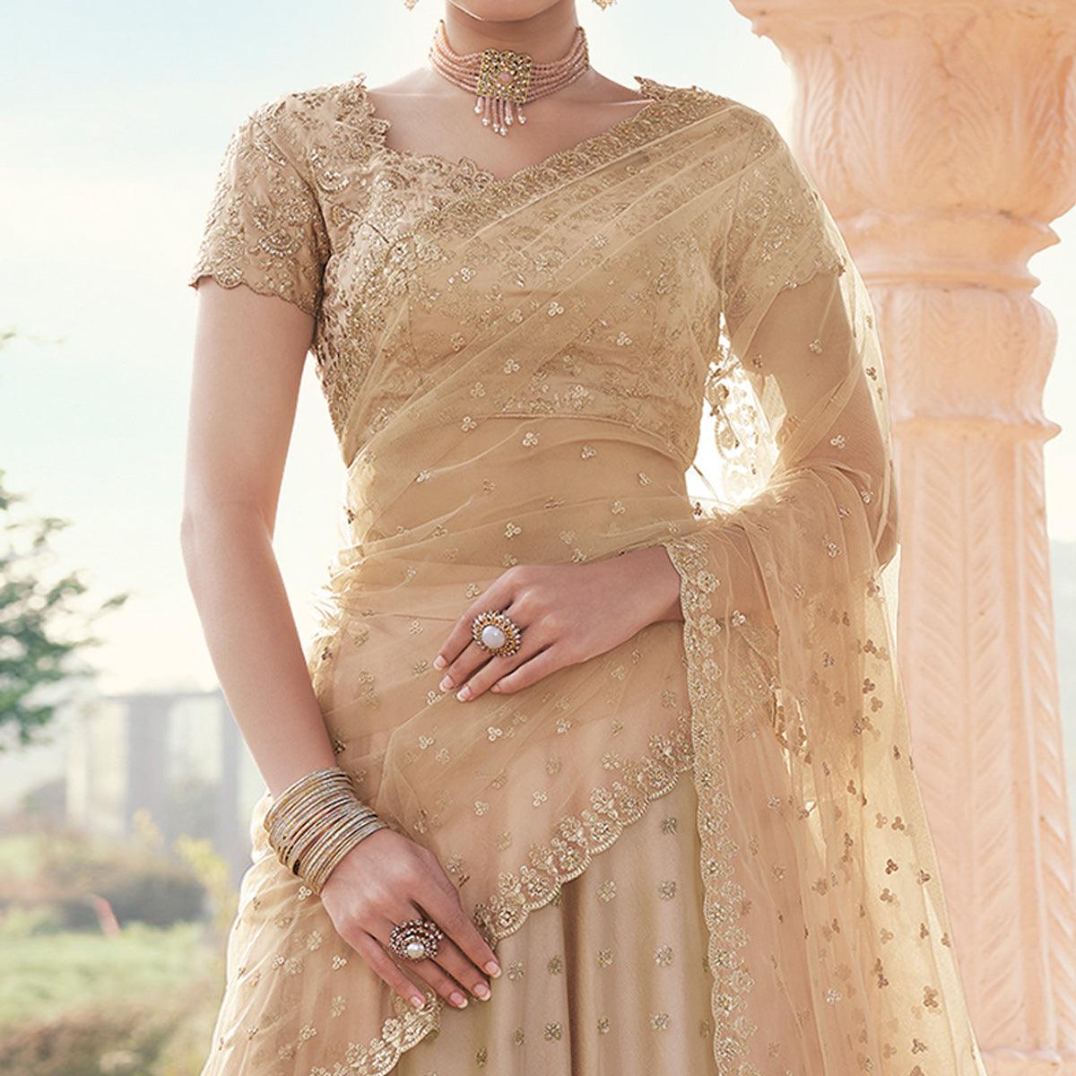 Beige Partywear Floral Embroidered With Zari Net Lehenga Choli - Peachmode