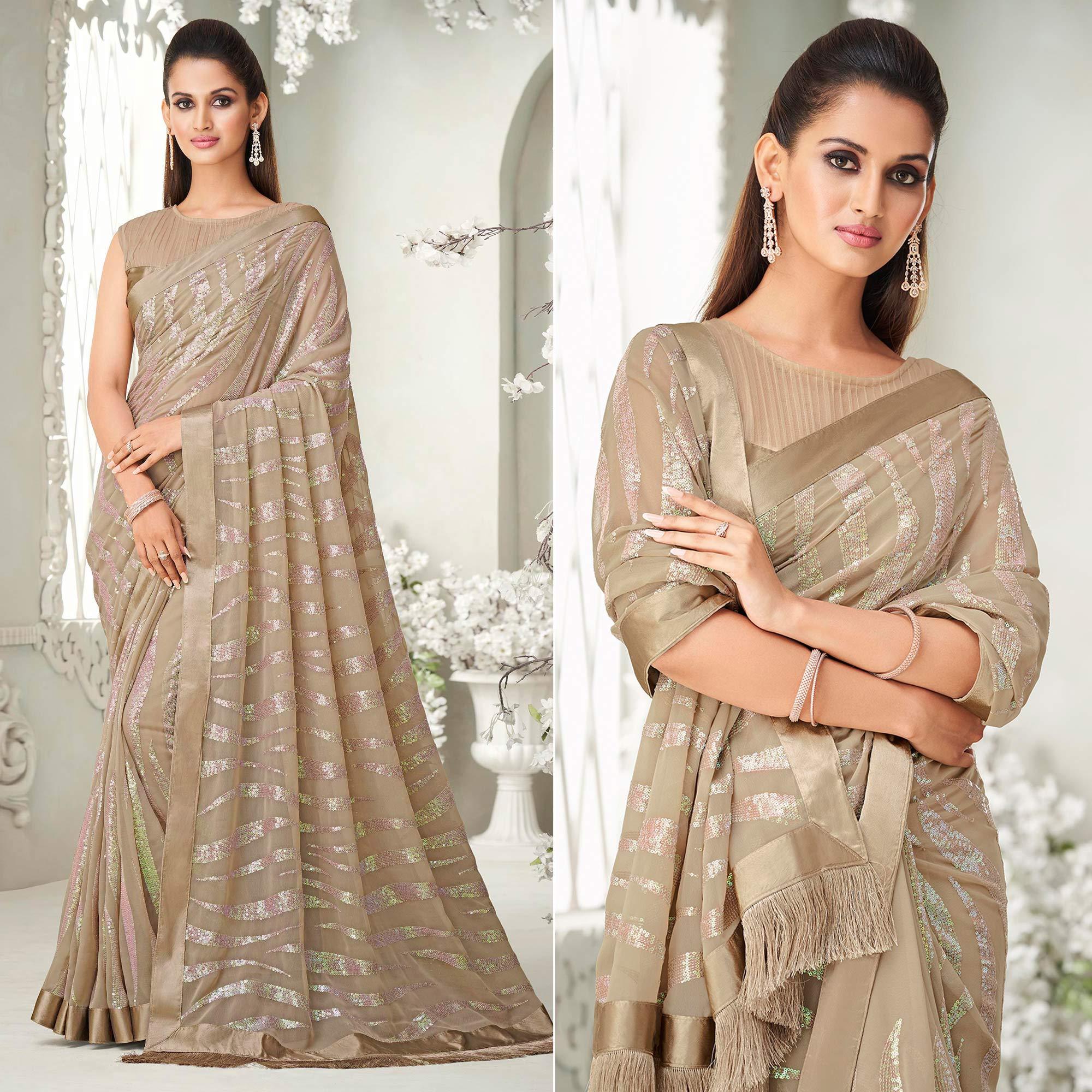 Beige Sequence Embroidered Georgette Saree With Tassels - Peachmode