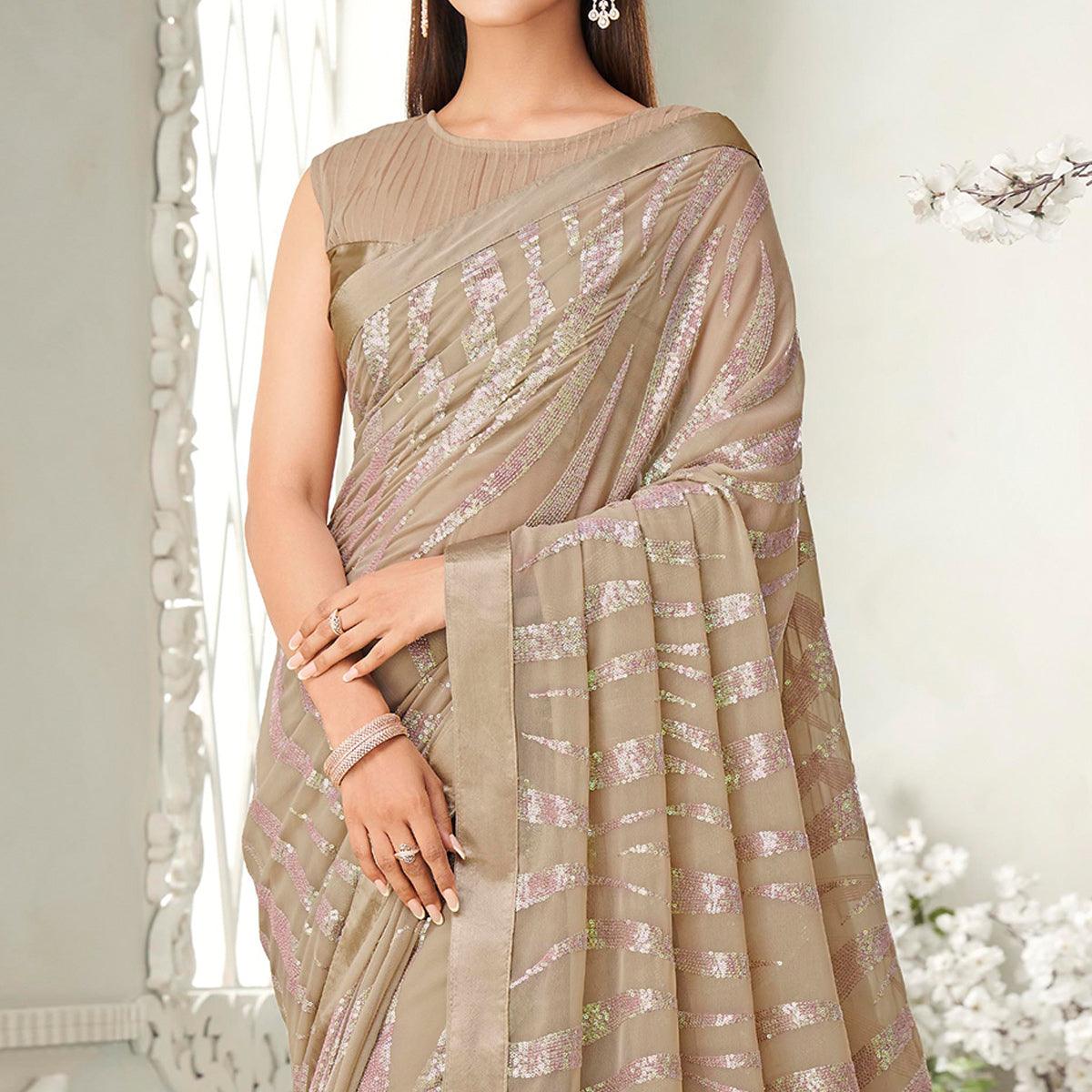 Beige Sequence Embroidered Georgette Saree With Tassels - Peachmode