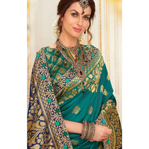 Blooming Rama Blue Colored Festive Wear Woven Work Banarasi Silk Saree - Peachmode