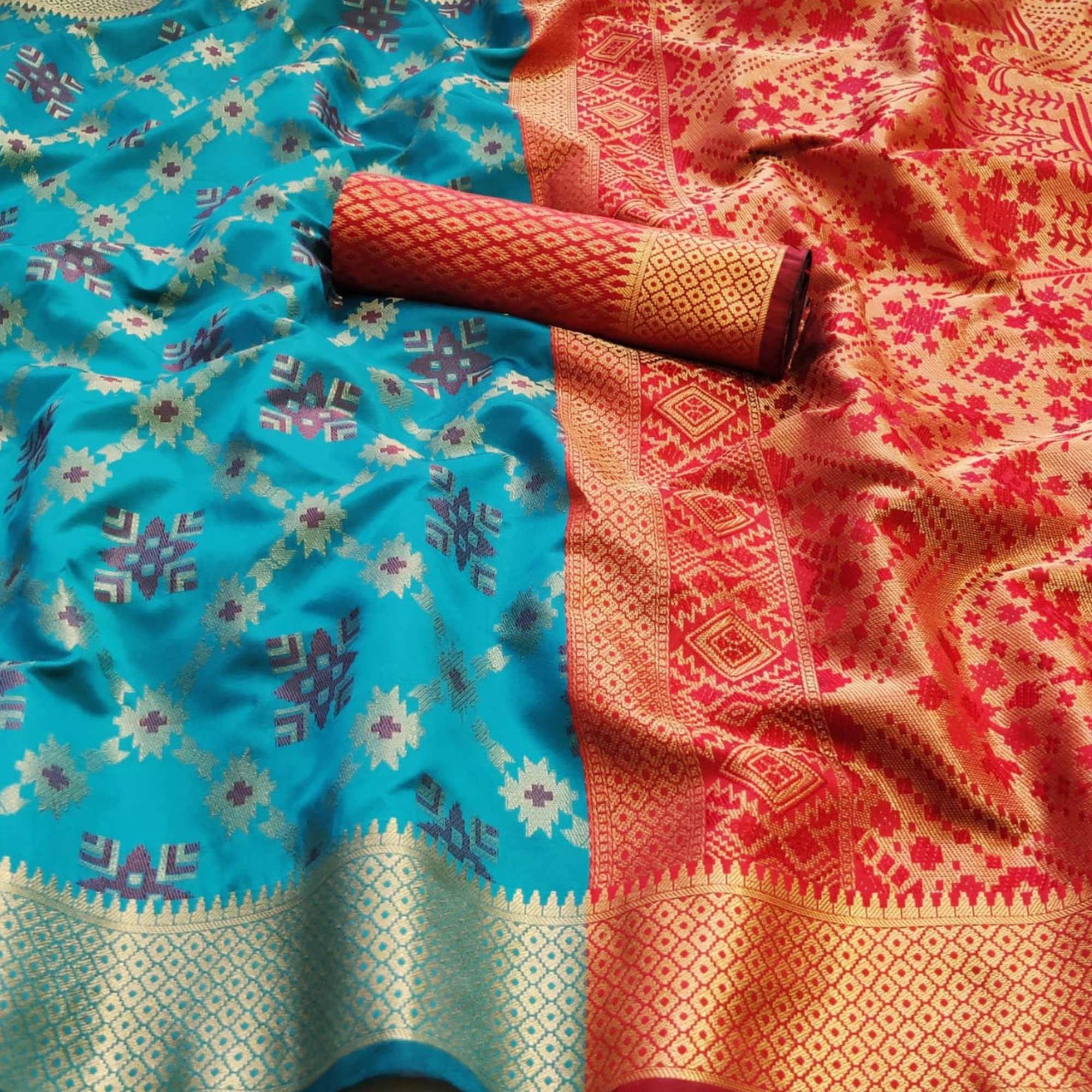 Blooming Turquoise Blue Colored Festive Wear Woven Patola Silk Saree - Peachmode
