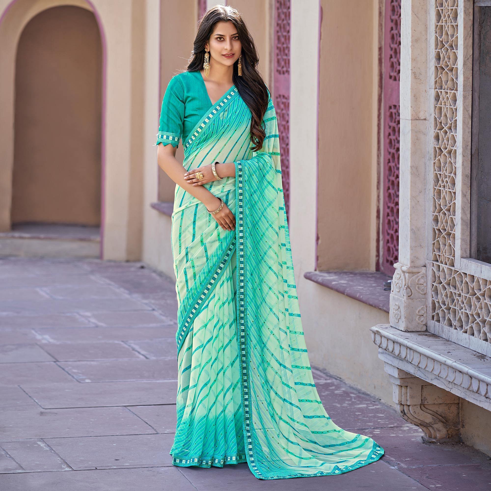 Blue Printed With Embellished Georgette Saree - Peachmode