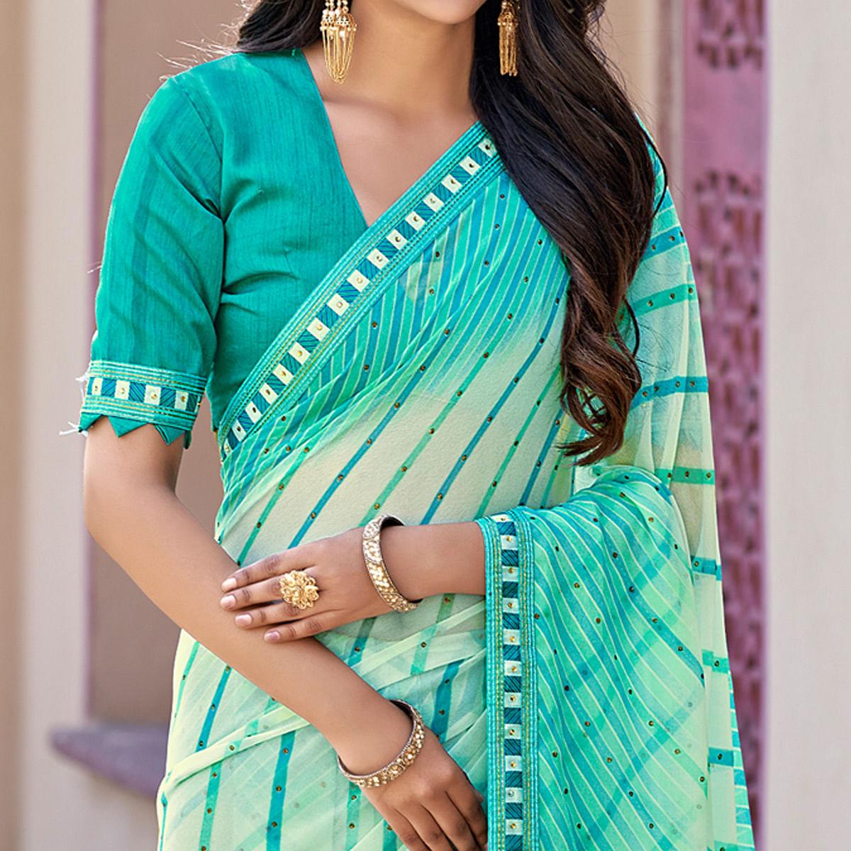 Blue Printed With Embellished Georgette Saree - Peachmode