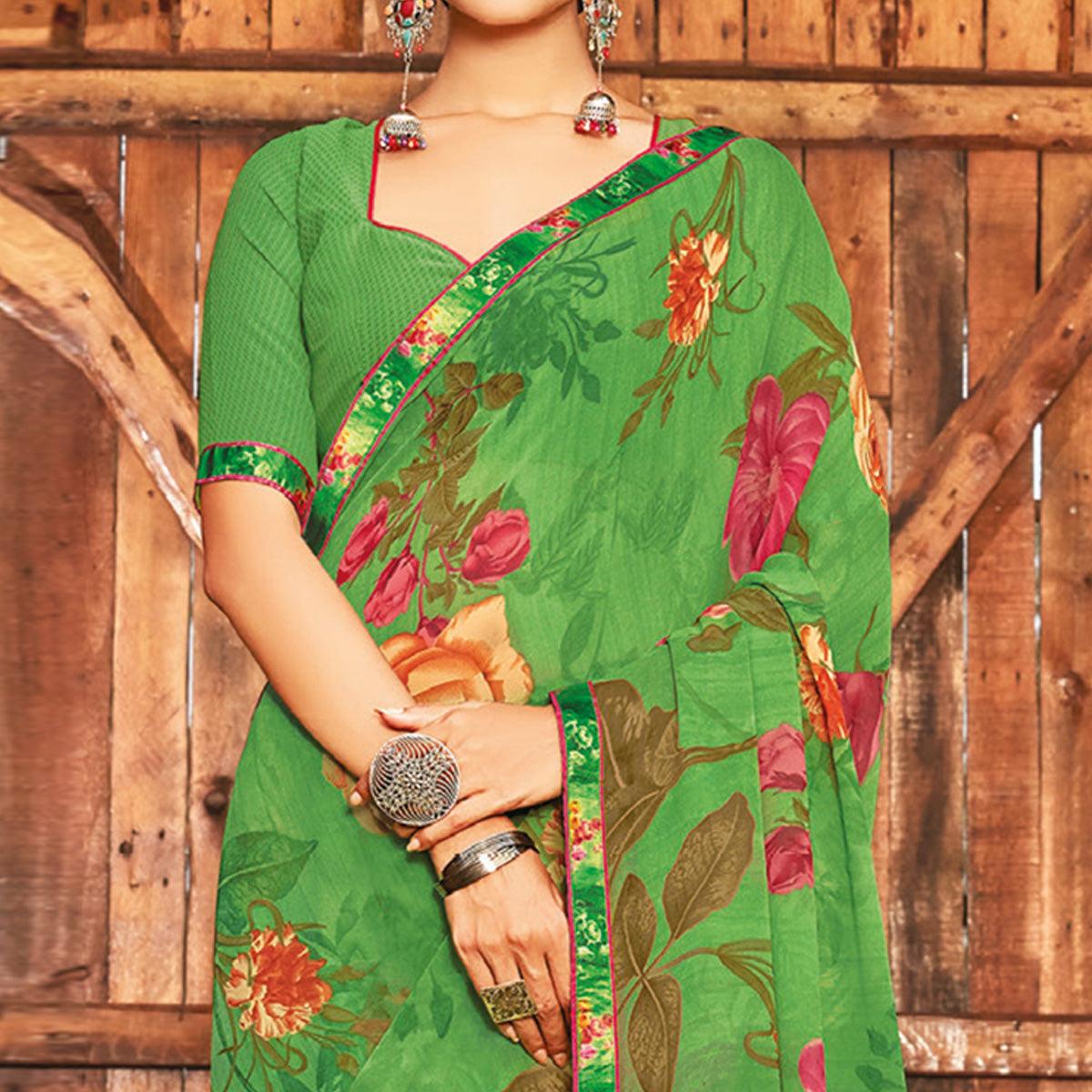Breathtaking Green Coloured Partywear Pure Georgette Floral Printed Saree With Fancy Lace Border - Peachmode