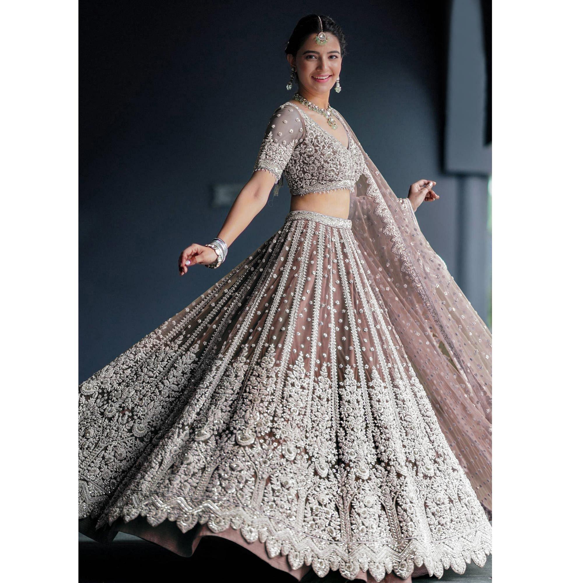 Brown Party Wear Heavy Embroidered Netted Lehenga Choli - Peachmode