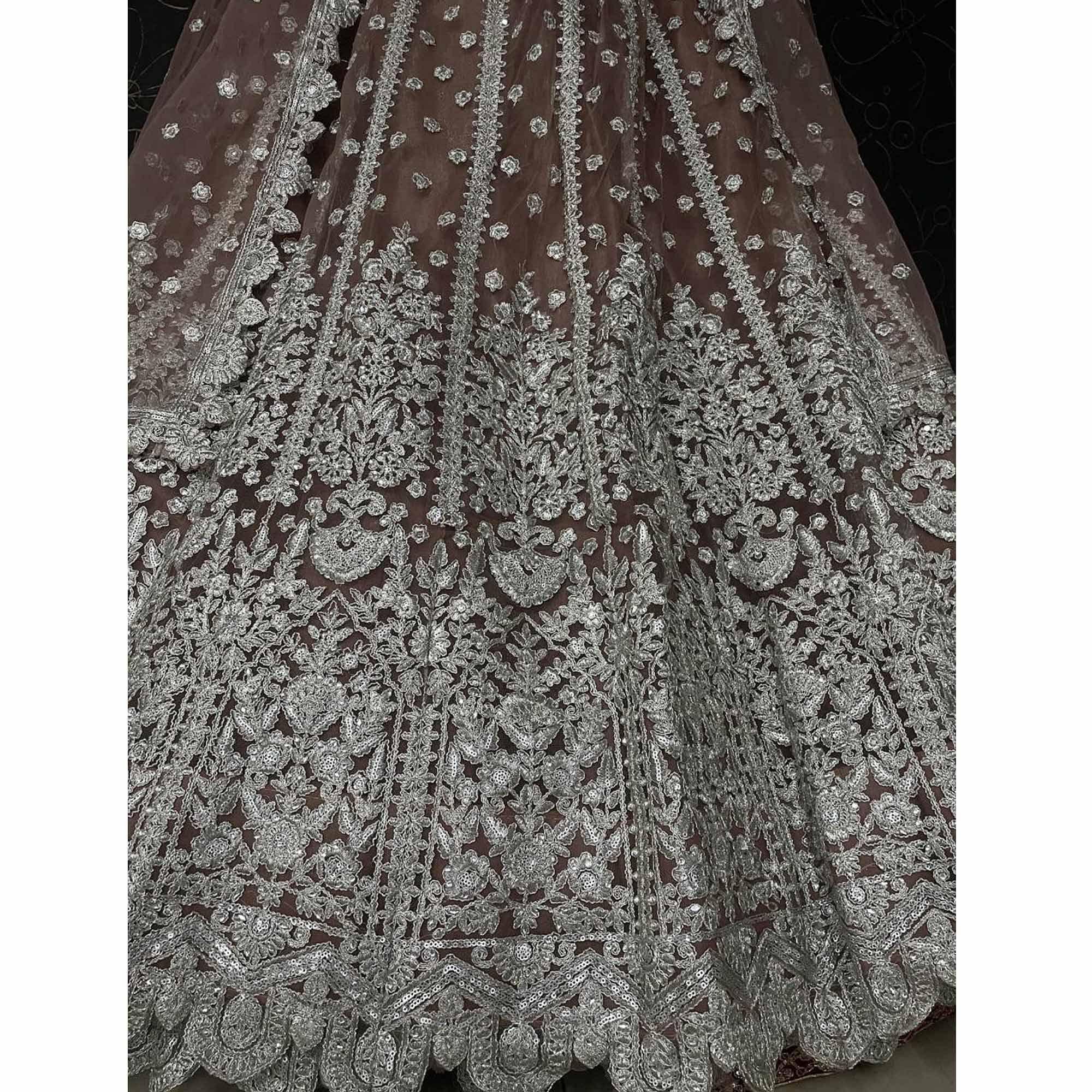 Brown Party Wear Heavy Embroidered Netted Lehenga Choli - Peachmode