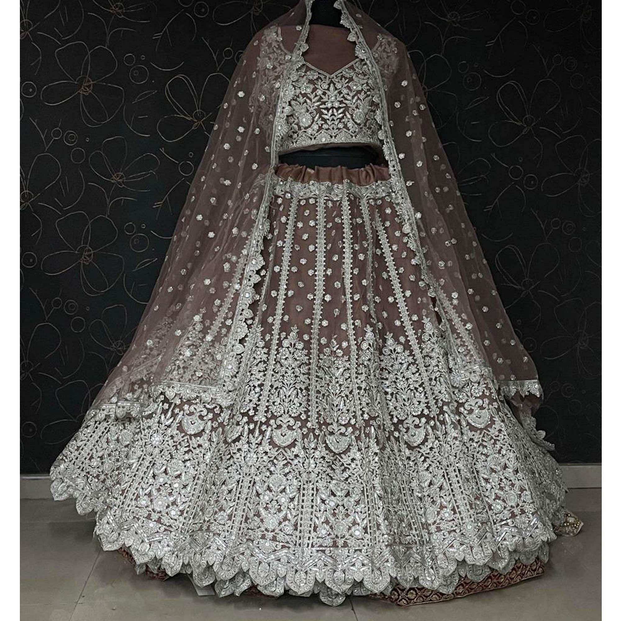 Brown Party Wear Heavy Embroidered Netted Lehenga Choli - Peachmode