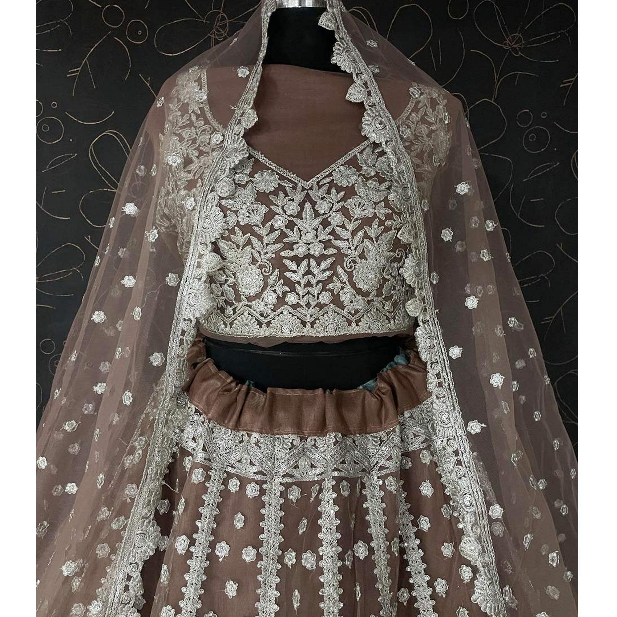 Brown Party Wear Heavy Embroidered Netted Lehenga Choli - Peachmode