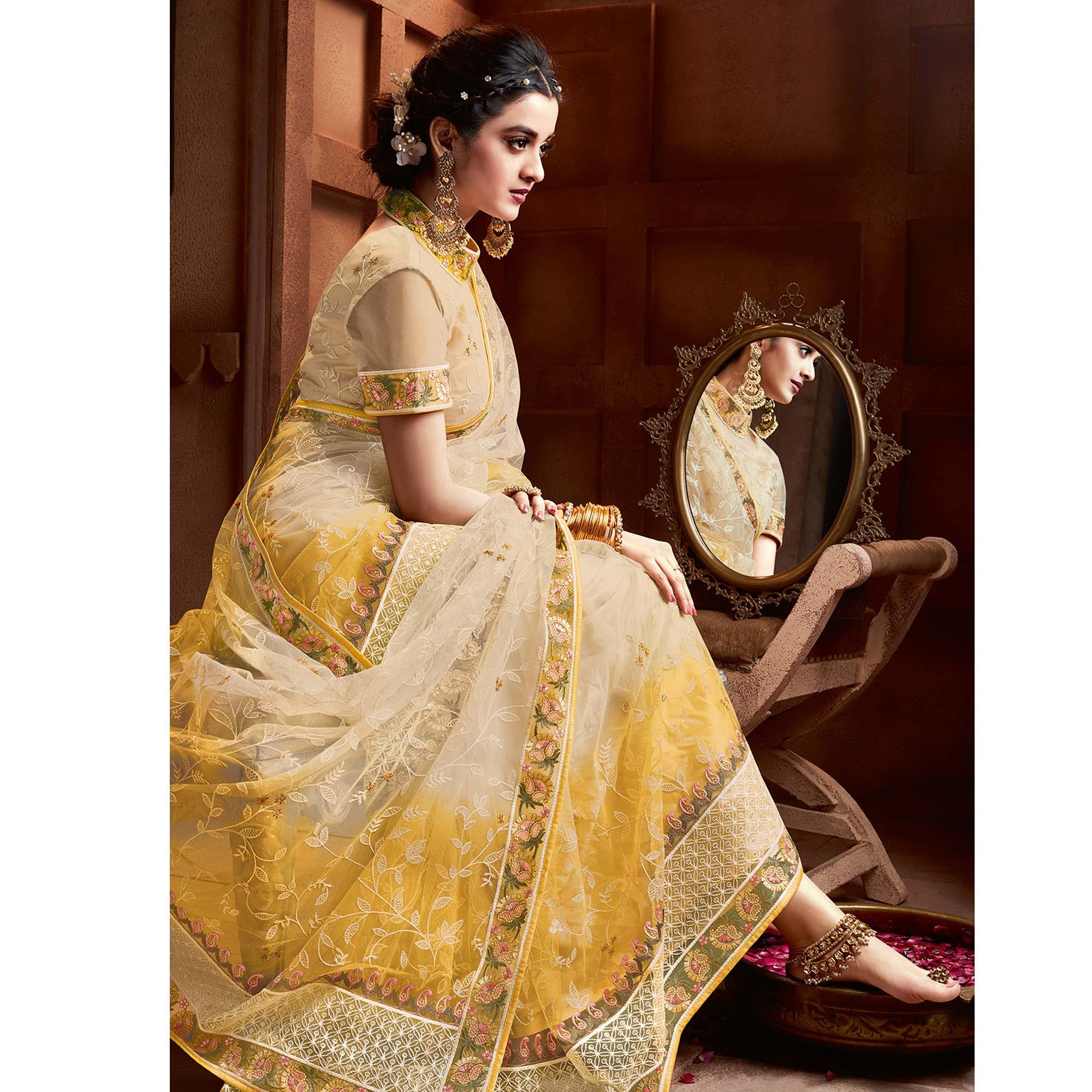 Capricious Beige & Mustard Coloured Partywear Embroidered Soft Net Saree - Peachmode