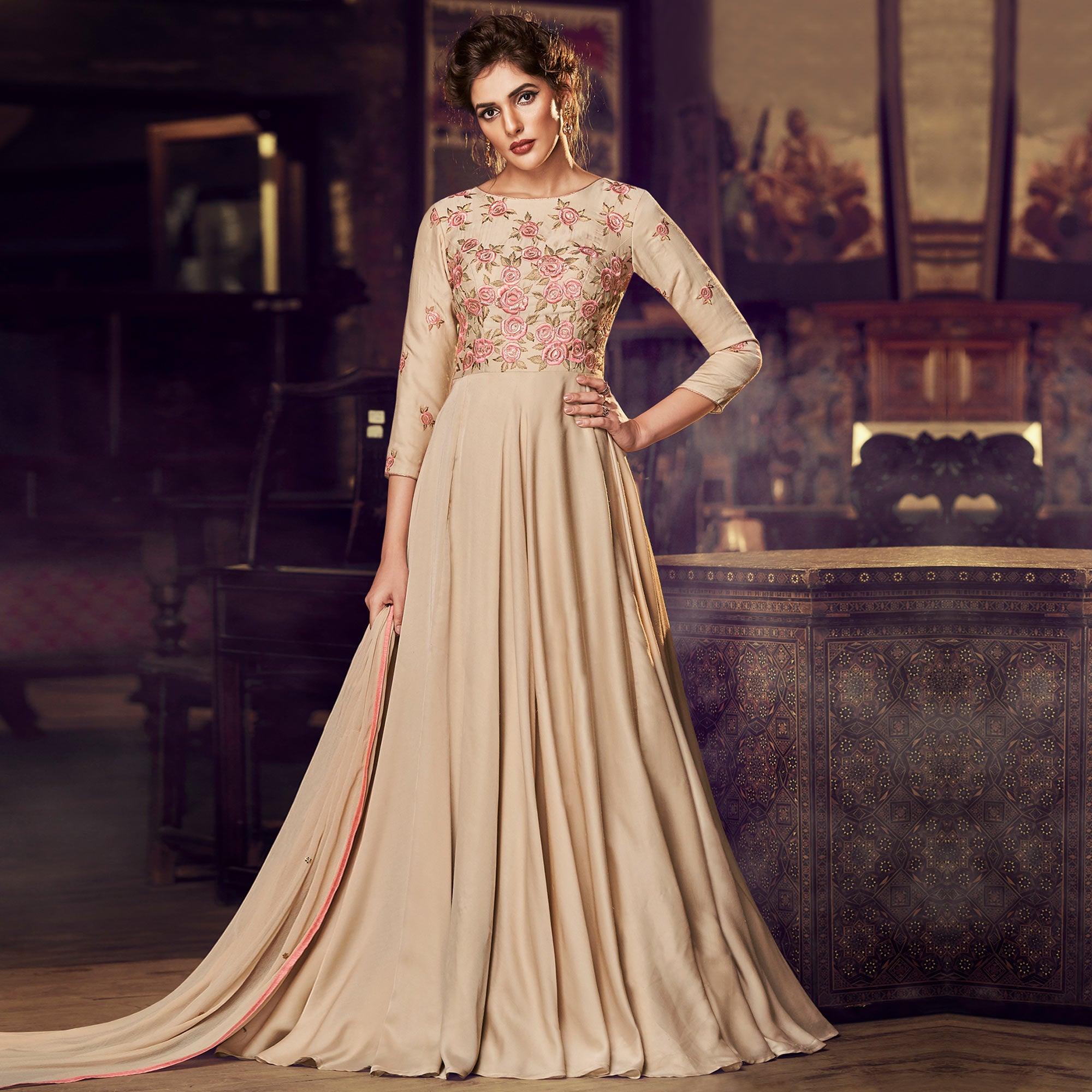 Capricious Chiku Colored Partywear Embroidered Modal Satin Gown With Dupatta - Peachmode