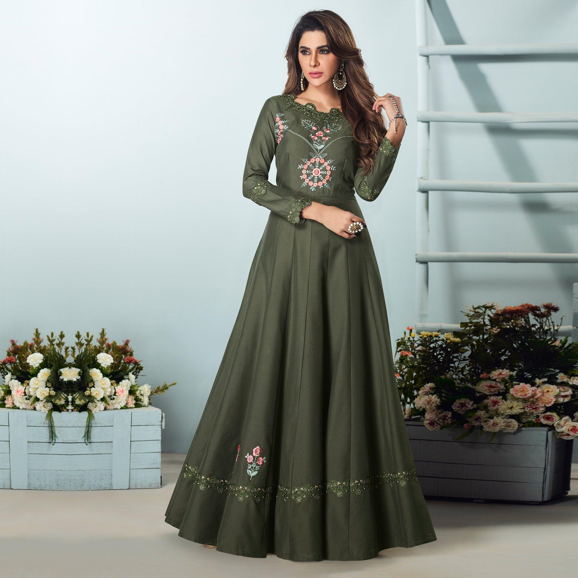 Capricious Dark Olive Green Colored Party Wear Embroidered Muslin Cotton Silk Gown - Peachmode