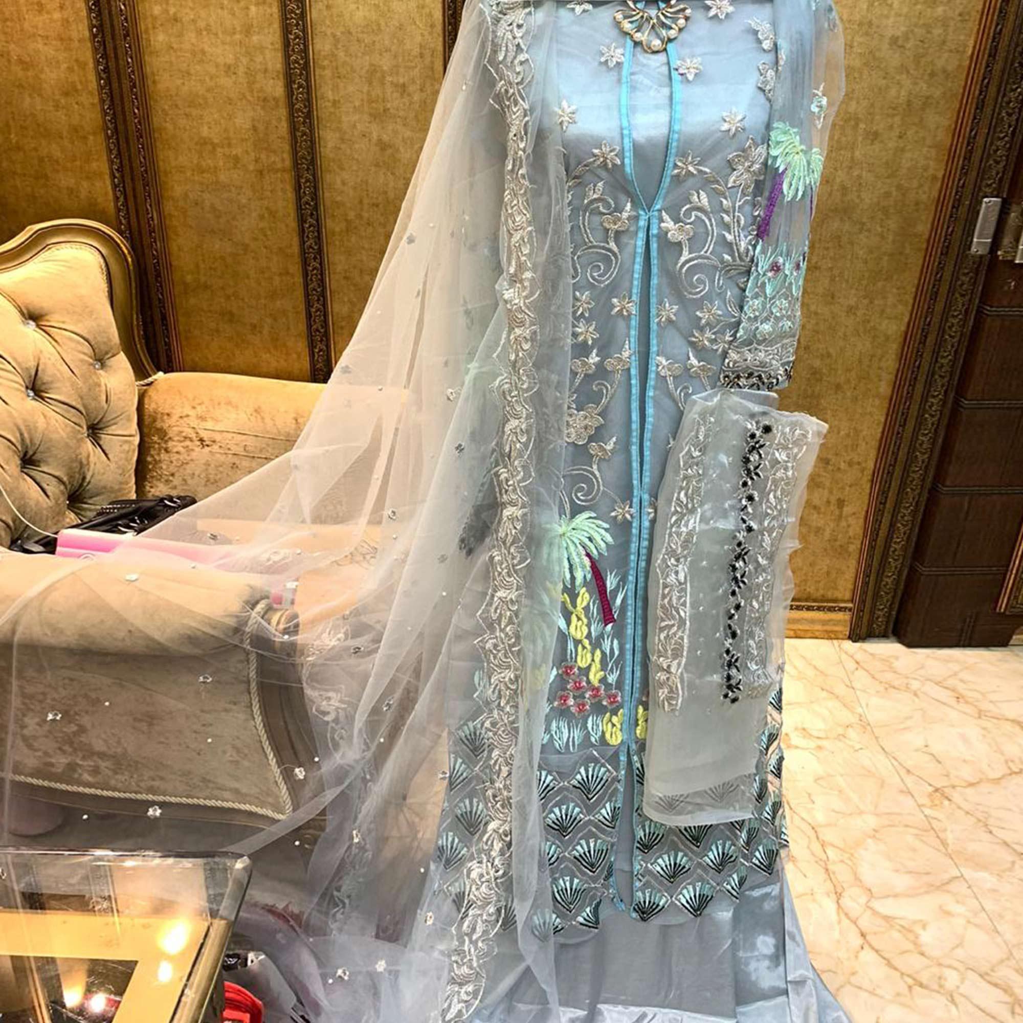 Capricious Light Blue Colored Partywear Embroidered Netted Palazzo Suit - Peachmode