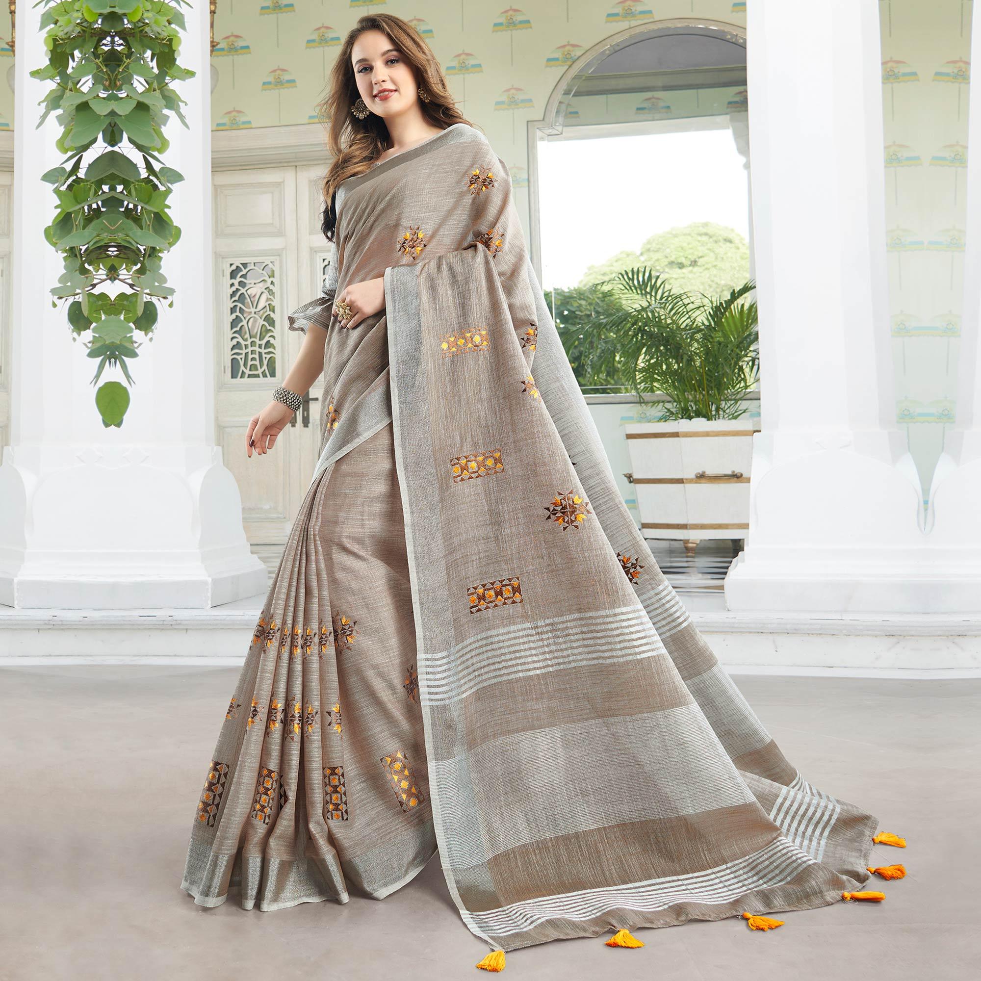 Classy Pastel Brown Colored Casual Wear Floral Embroidered Linen-Cotton Saree With Tassels - Peachmode