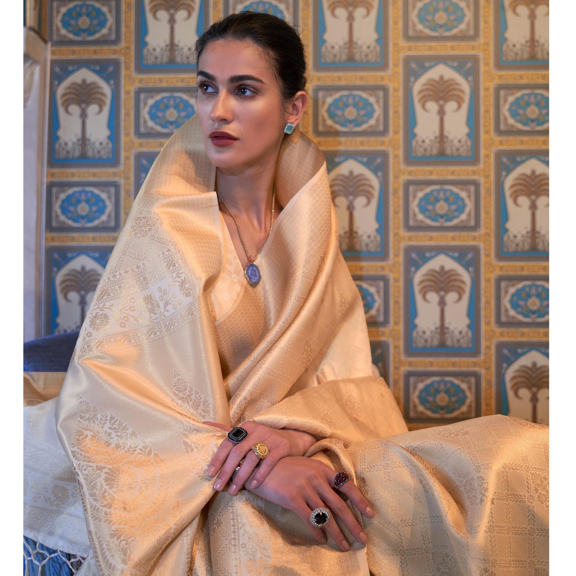 Cream Woven Art Silk Saree With Tassels - Peachmode