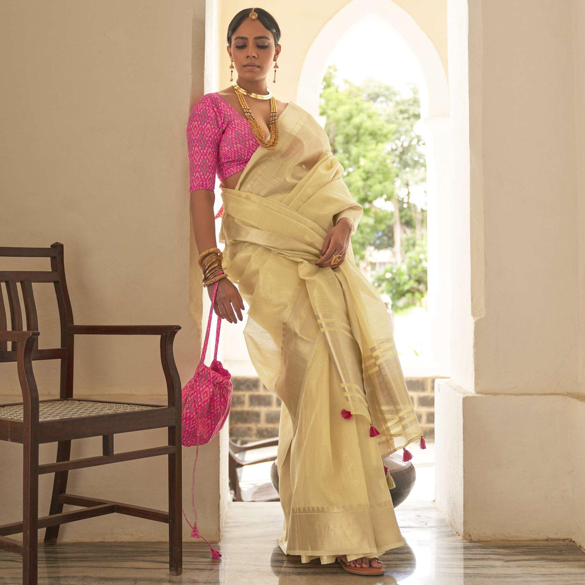Cream Woven Organza Saree With Tassels - Peachmode