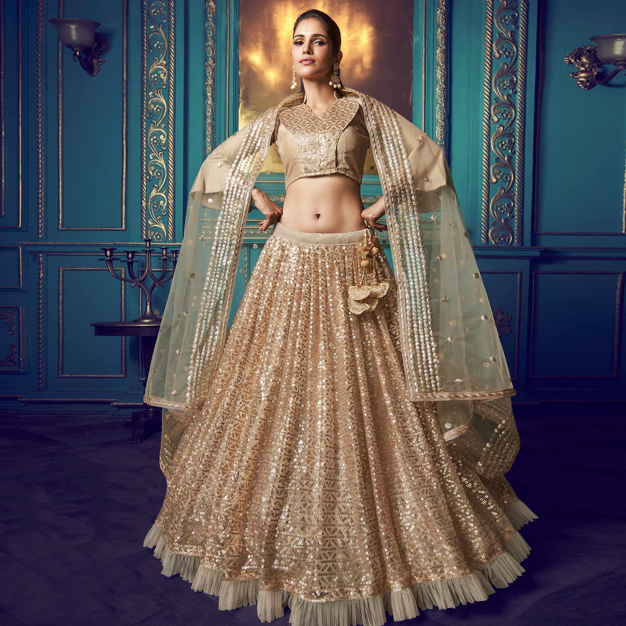 Dazzling Beige Colored Partywear Embroidered Soft Net Lehenga Choli - Peachmode