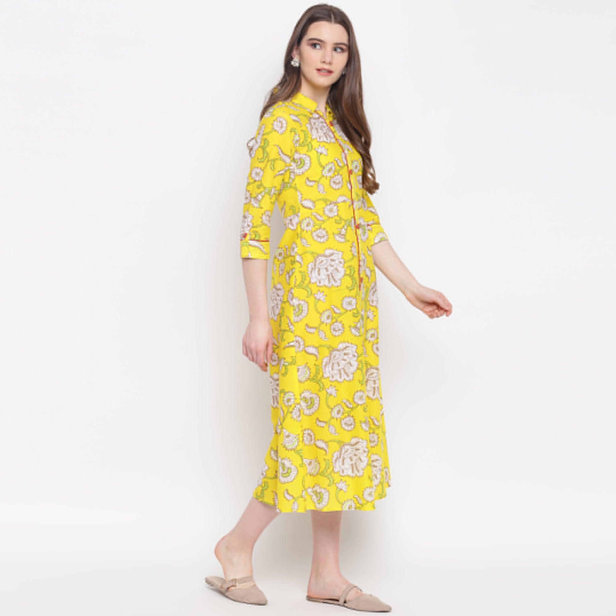 Delightful Lemon Yellow Colored Casual Wear Printed A-Line Calf Length Cambric Kurti - Peachmode